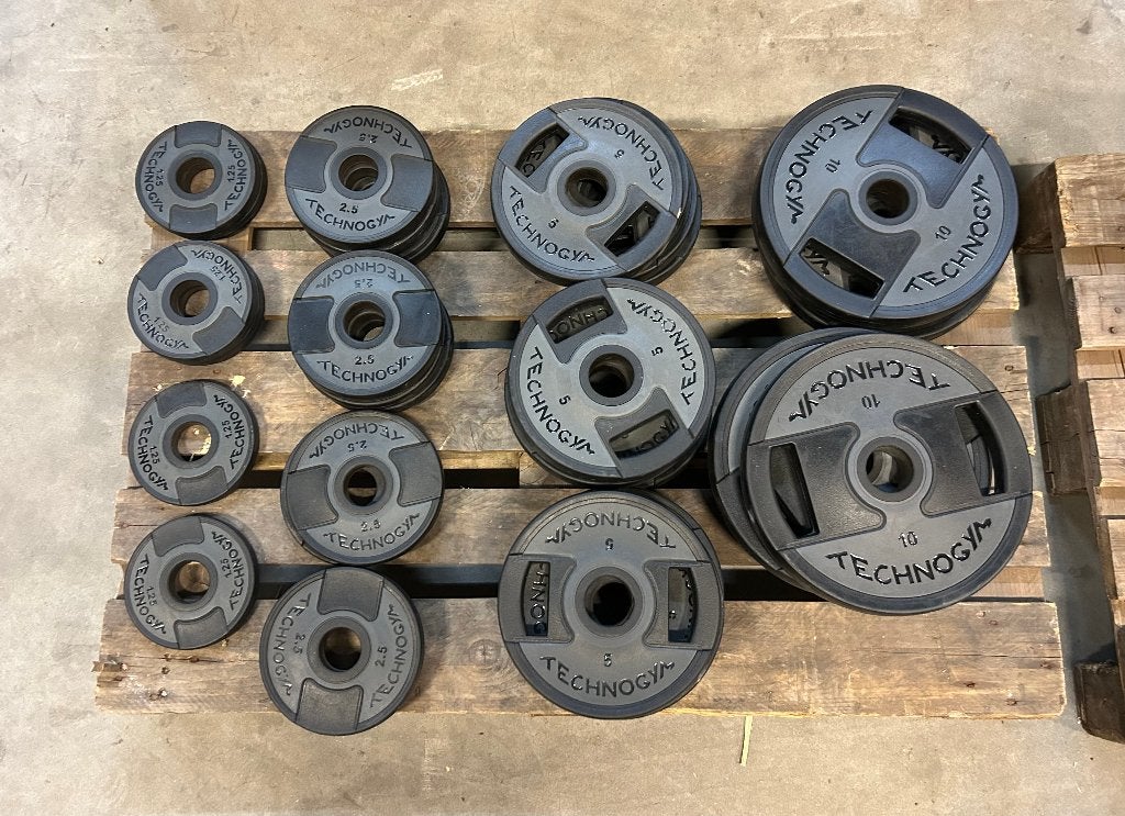 Technogym Olympische Halterschijven Set, Sport en Fitness, Fitnessmaterialen, Ophalen, Zo goed als nieuw, Benen, Halterschijven
