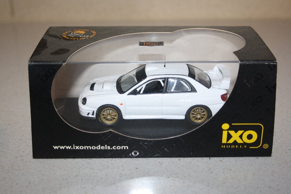 1:43 IXO Subaru Impreza WRC rally spec wit., Hobby en Vrije tijd, Modelauto's | 1:43, Ophalen of Verzenden, Zo goed als nieuw
