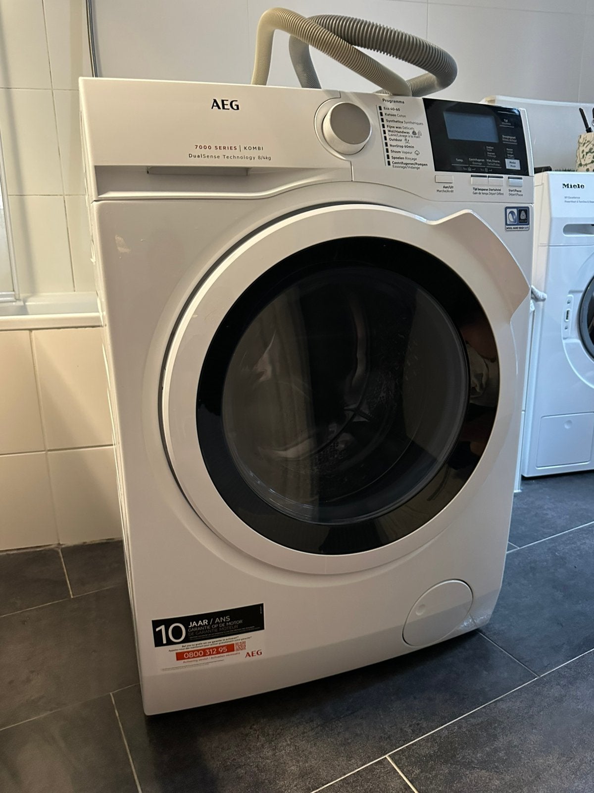 AEG was-droogcombinatie Dualsense serie 7000, Elektronische apparatuur, 6 tot 8 kg, Ophalen, Gebruikt, 85 tot 90 cm