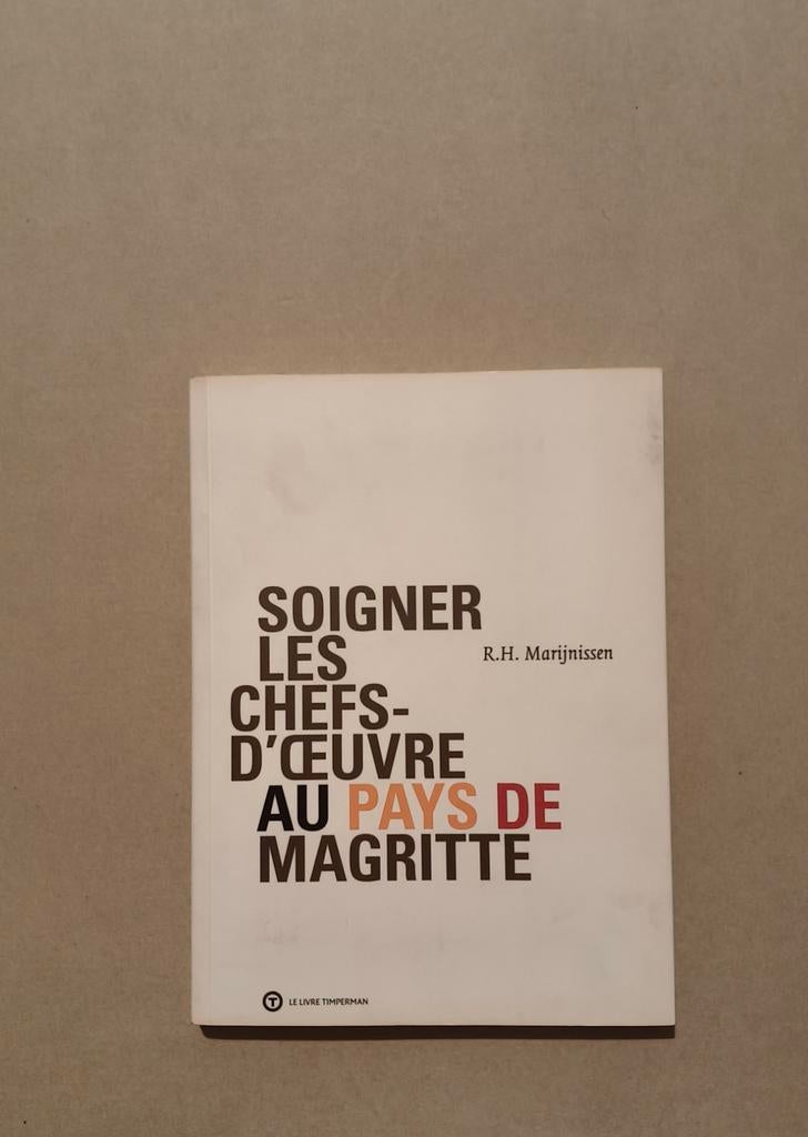 Boek „De zorg voor meesterwerken in het land van Magritte”, Boeken, Ophalen of Verzenden