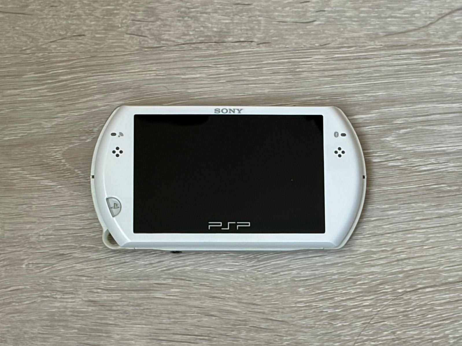 Sony PSP Go Wit + Originele Oplader + Volledig Werkend, Games en Spelcomputers, Ophalen of Verzenden, Zo goed als nieuw