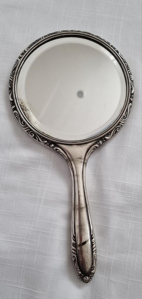 Miroir à main en argent antique, Enlèvement