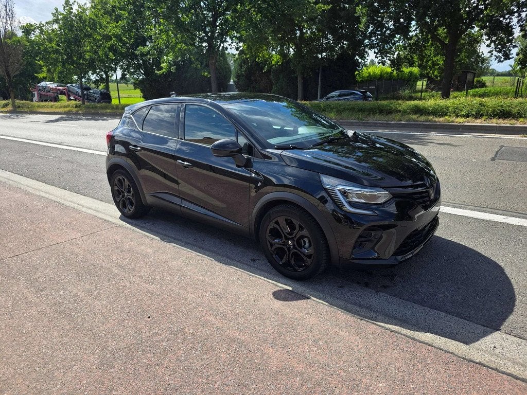 Renault Captur 1.6i E-TECH Hybride MHVE Black Edition AUT. 2, Auto's, Gebruikt, 4 cilinders, Zwart, Bedrijf