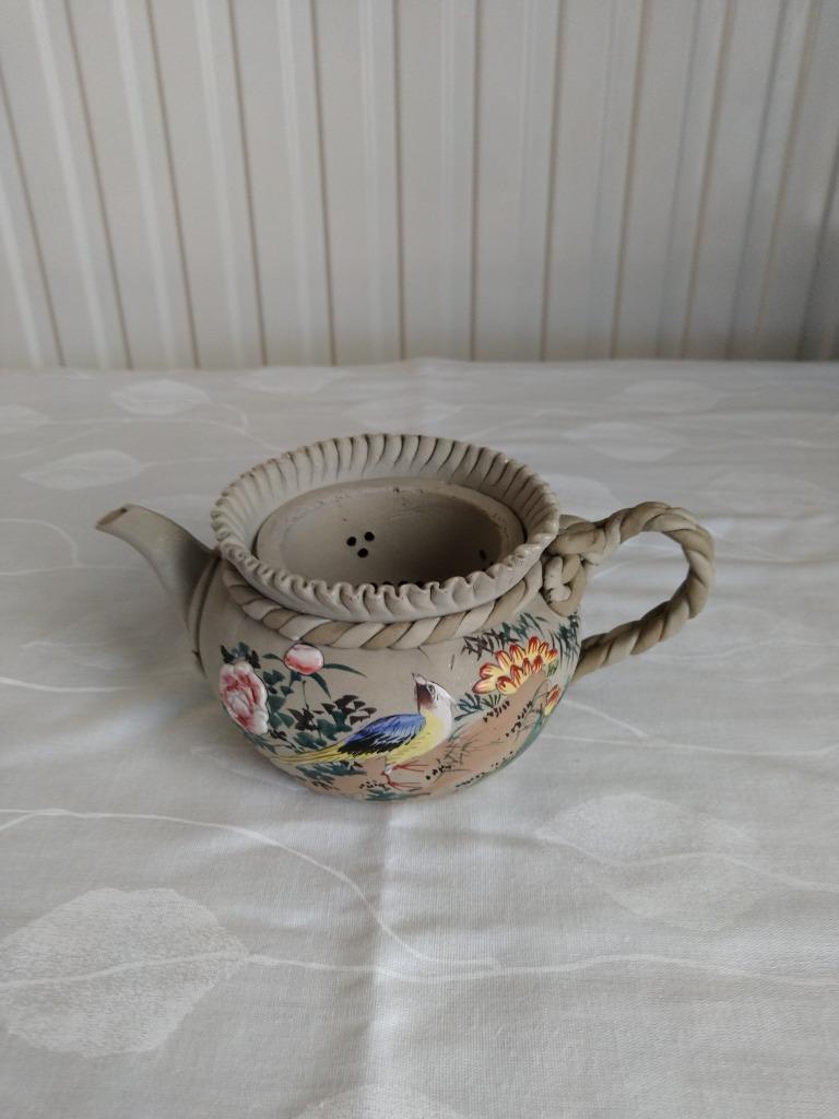 Chinese theepot van geglazuurde klei, Ophalen