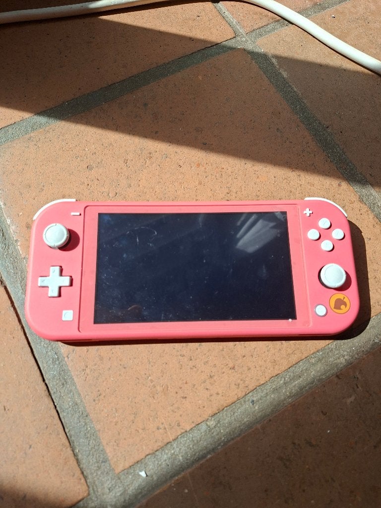 Nintendo Switch Lite – Koraalroze, Games en Spelcomputers, Spelcomputers | Nintendo Switch Lite, Ophalen of Verzenden, Roze of Coral
