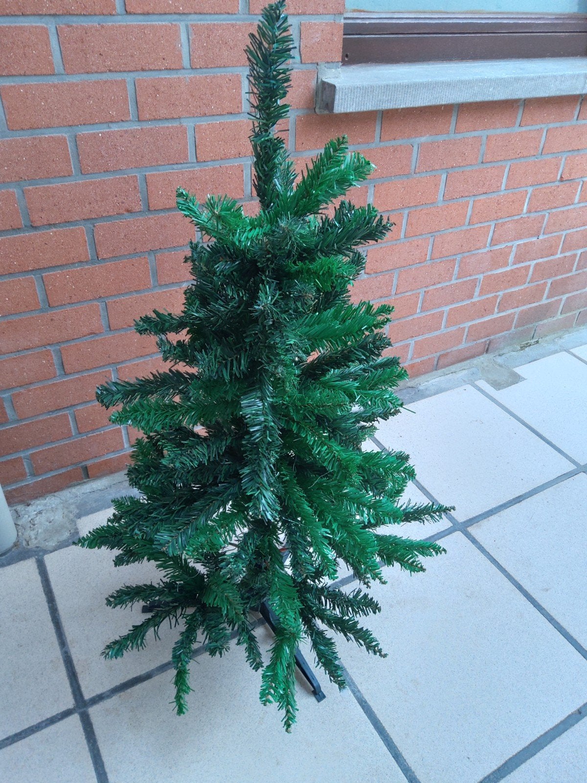 kerstboom met kerstballen, Ophalen
