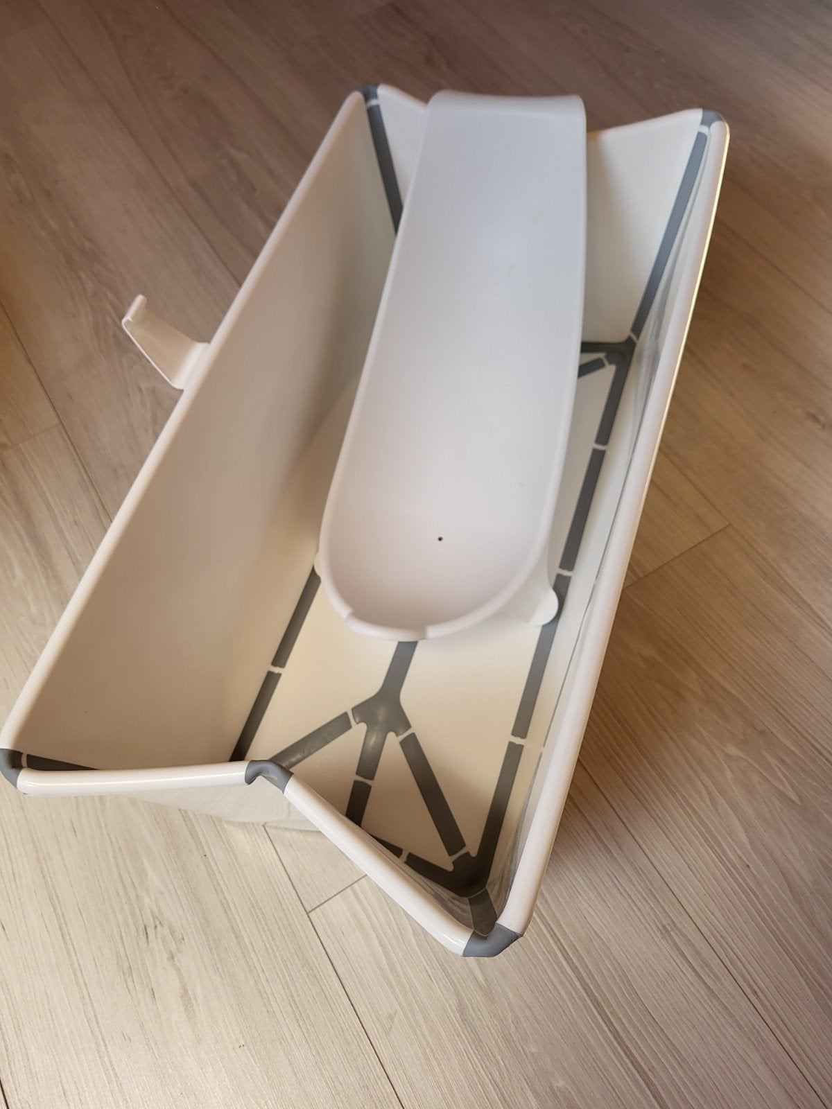 Stokke babybadje met zitje, Ophalen