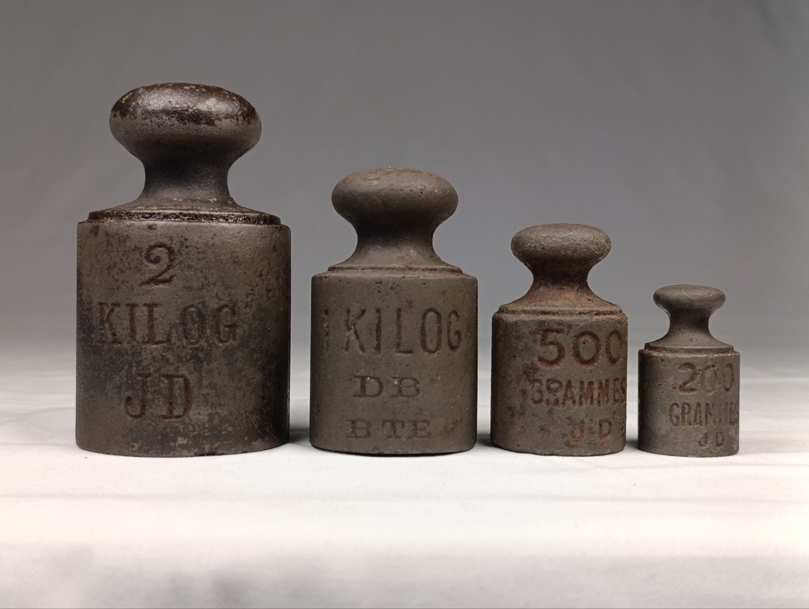 Set van 4 antieke gietijzeren knopgewichten, Antiek en Kunst, Ophalen of Verzenden