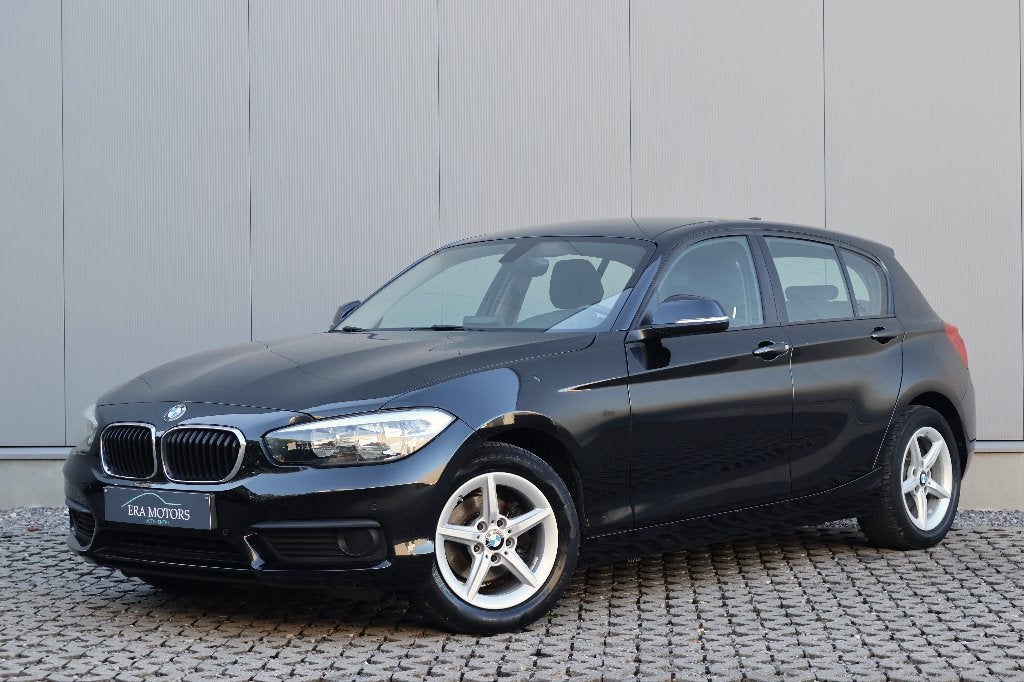 BMW 116i (EU6d-TEMP) Navi Airco Zetelverw Garantie *, Auto's, Voorwielaandrijving, Dealer onderhouden, 4 cilinders, Zwart