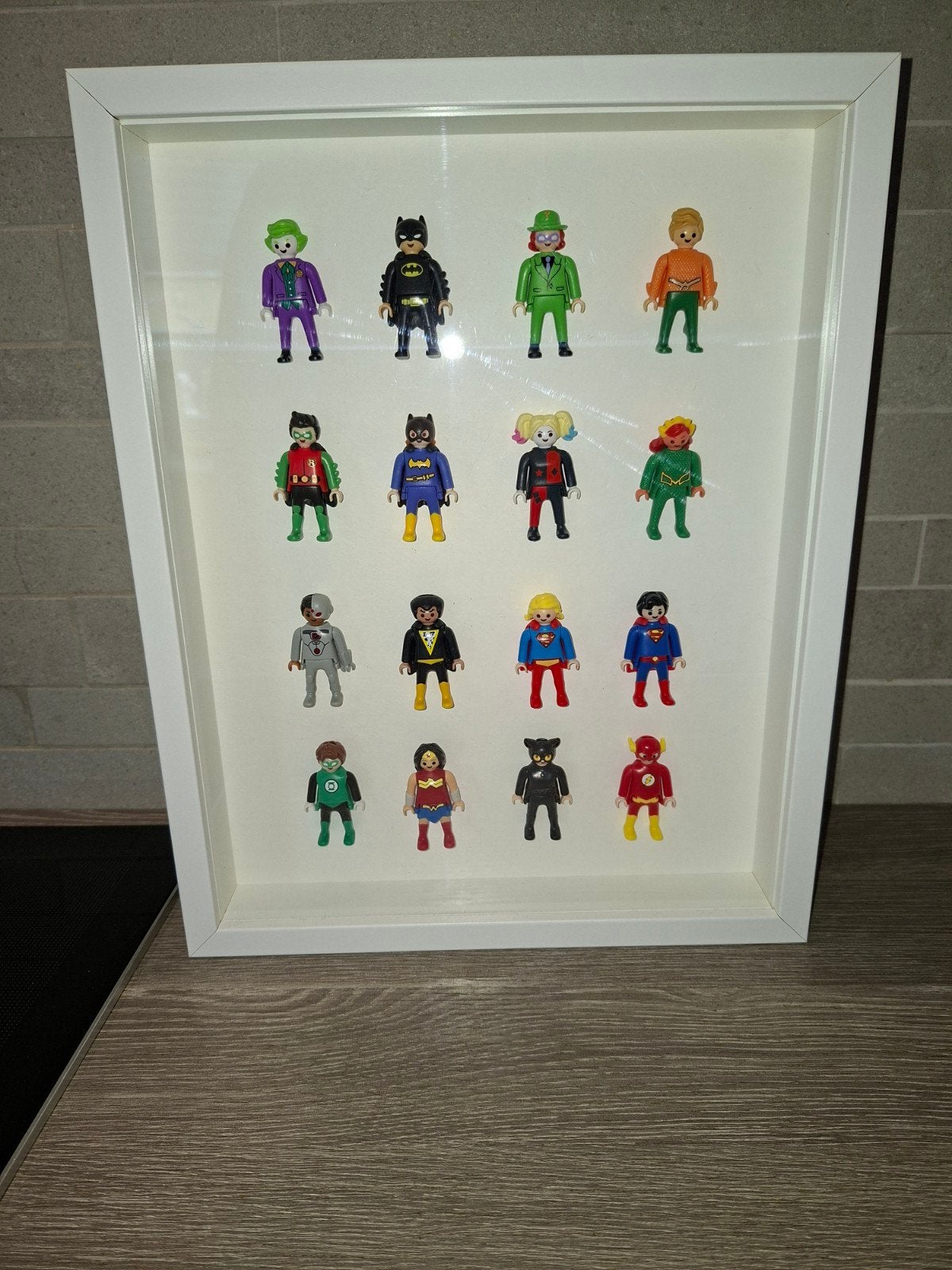Kader met superhelden playmobil, Ophalen