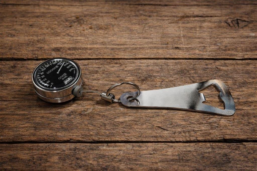 Automatische Sleutelhanger - Flessenopener - KM Teller Desig, Verzenden