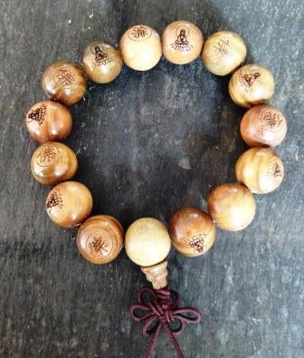 Sandelhout Boeddha armband uit Tibet, Handtassen en Accessoires, Armbanden, Ophalen of Verzenden, Nieuw, Bruin, Hout