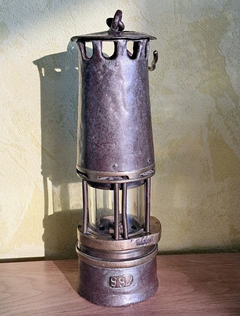 Lampe de mineur, Enlèvement, Bronze