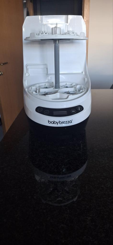 Baby flessenwasser. wassen, steriliseren en drogen, Ophalen