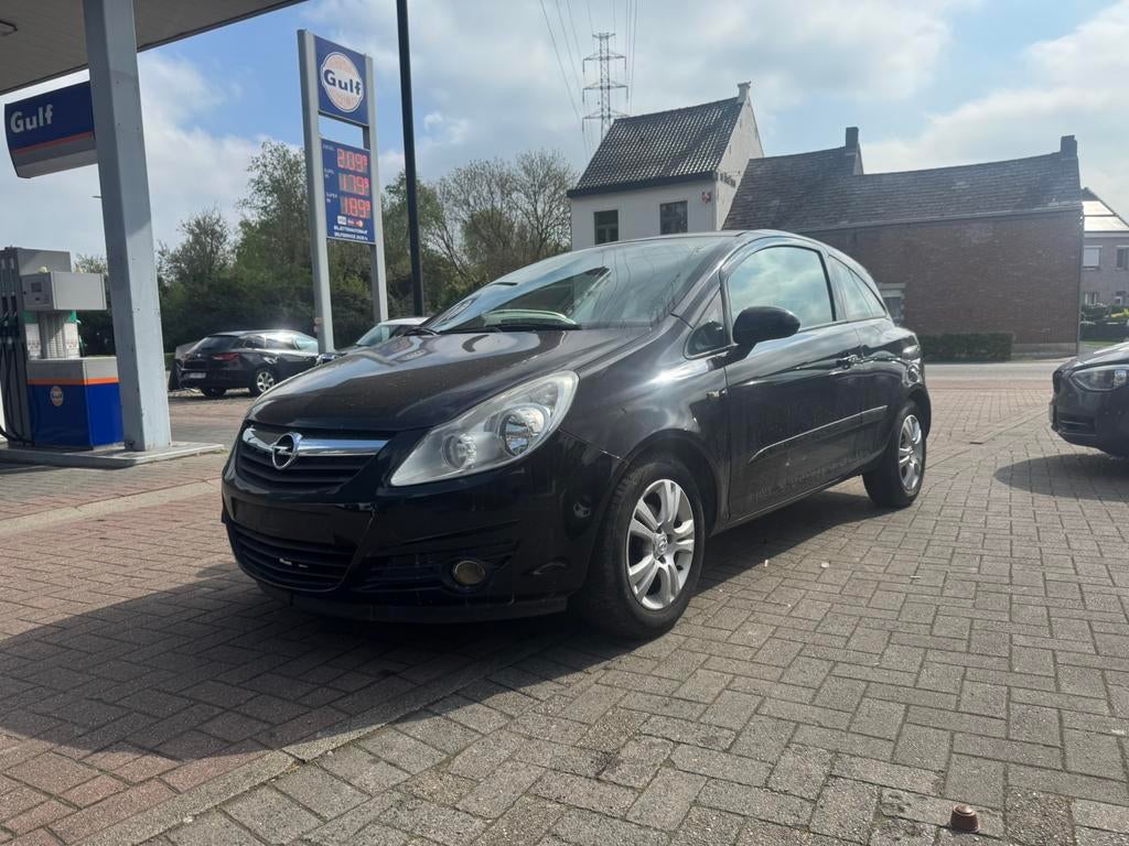 Opel Corsa 1.2 - BENZINE - AIRCO - 143.000 km - 2007, Auto's, Stof, 1229 cc, Zwart, Bedrijf