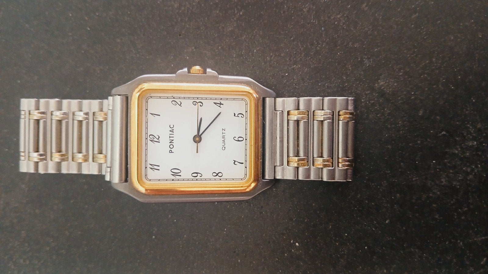 Montre à quartz Pontiac vintage — En état de marche, Enlèvement ou Envoi, Acier
