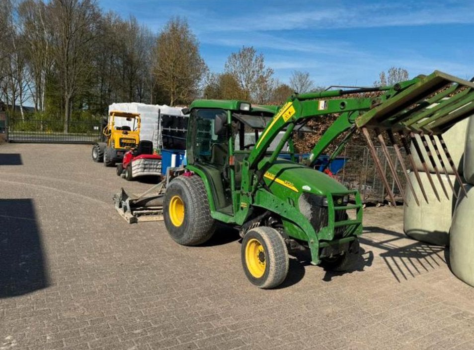 Nette John Deere met voorlader, Ophalen