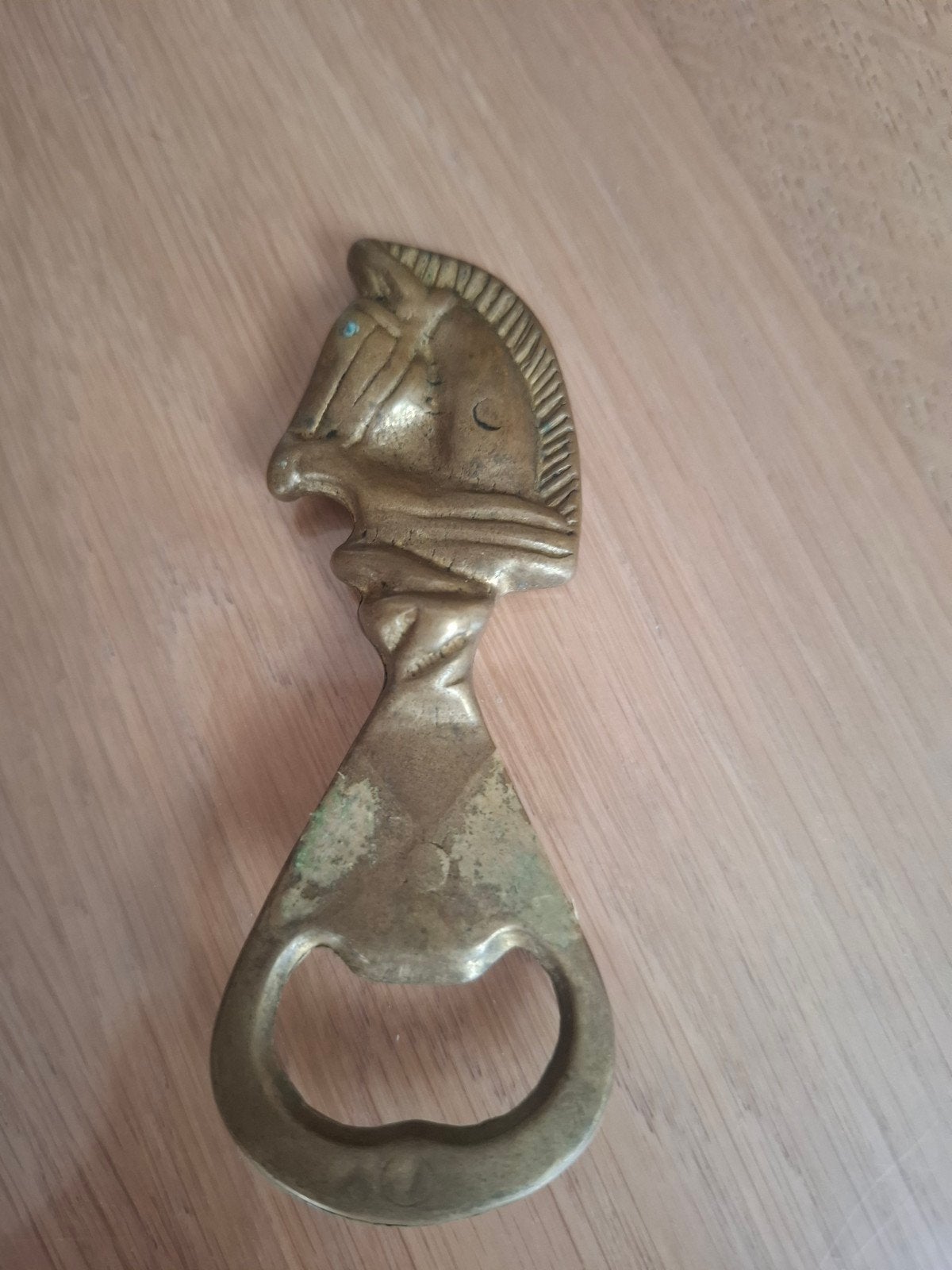 antiek flesopener met hoofd paard erop, Ophalen