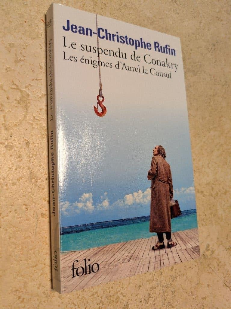 Le suspendu de Conakry (Jean-Christophe Rufin)., Livres, Jean-Christophe Rufin., Comme neuf, Europe autre, Envoi