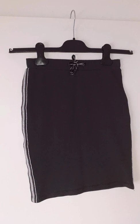 Maat 140 Zwart rokje glitter streep zijkant Jbc, Meisje, Ophalen of Verzenden, Zo goed als nieuw, Jurk of Rok