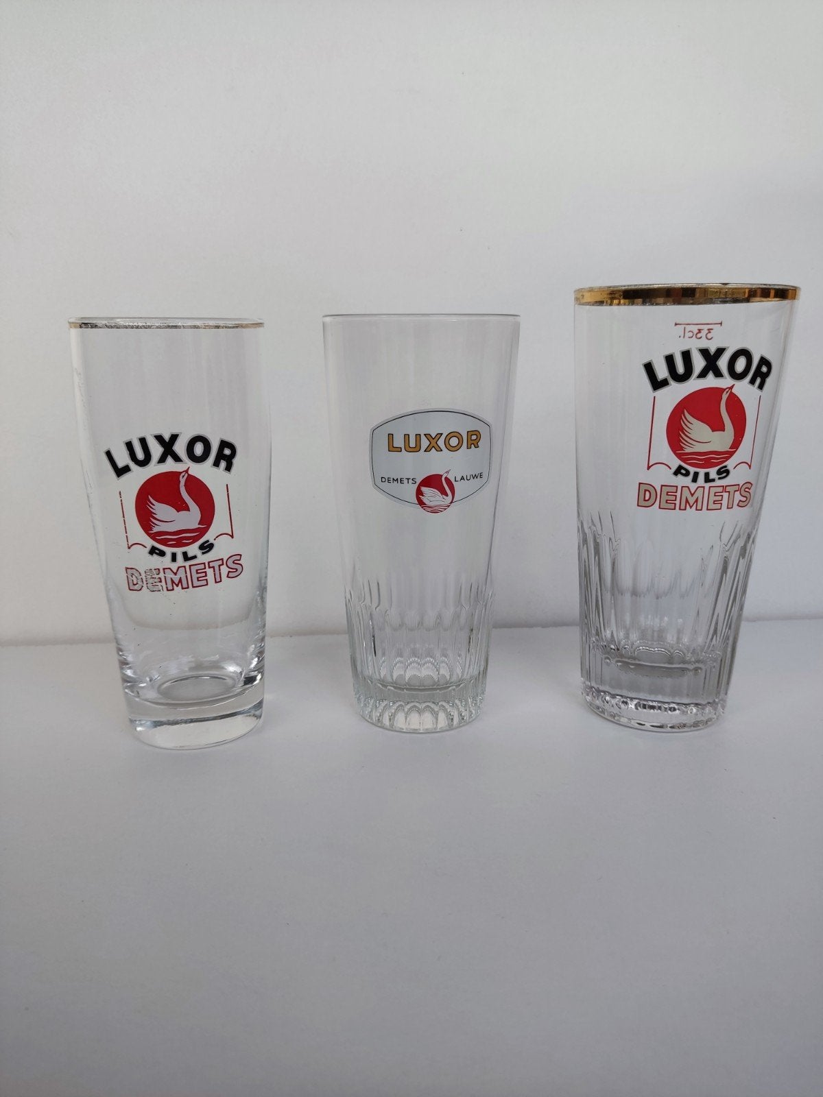 3x Vintage Belgische Bierglazen – Luxor Pils Demets Lauwe –, Ophalen, Zo goed als nieuw, Glas of Glazen, Overige merken