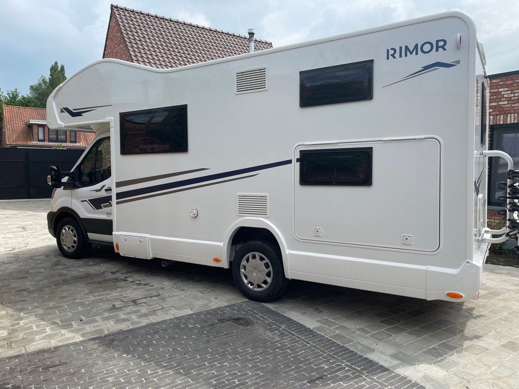 TE HUUR Mobilhome Ford Rimor Evo Sound Alkoof voor 7 pers!, Caravanes & Camping, Siège de train, 6 à 7 mètres, Boîte manuelle
