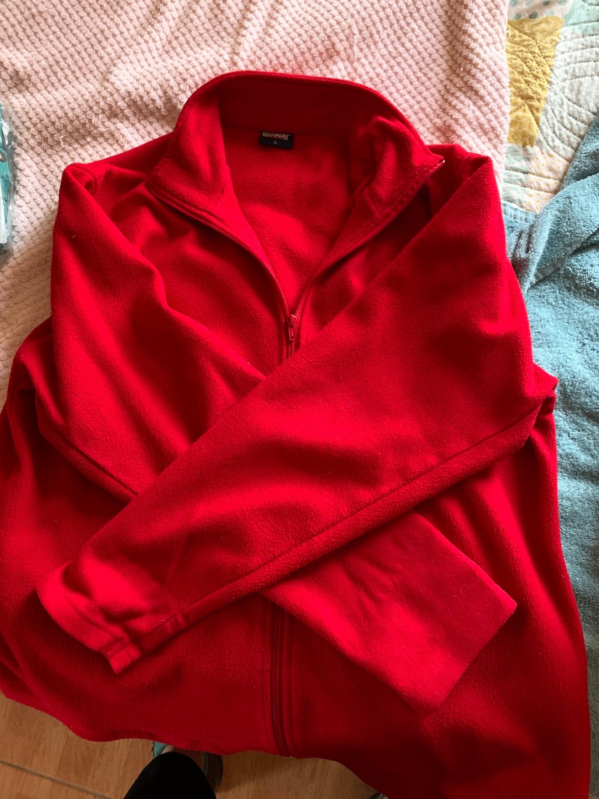 Veste polar Donnay rouge, Ophalen, Gedragen