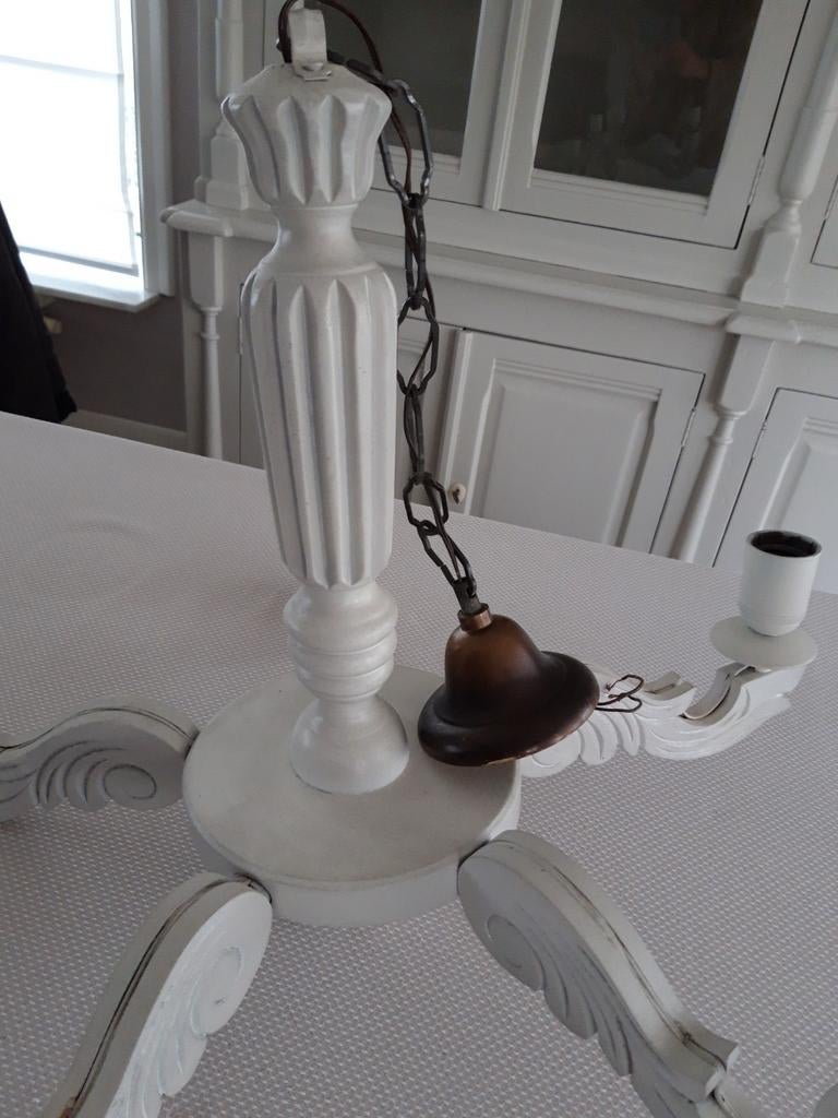 Houten kroonluchter, Ophalen