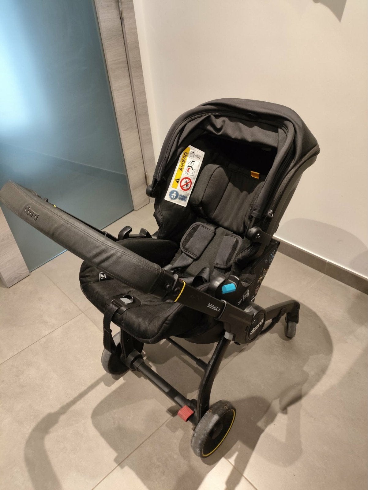 Poussette Doona X avec base isofix, Enlèvement, Protection de pluie