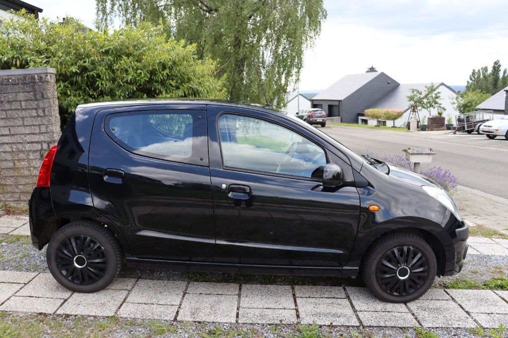 Nissan Pixo 2013 1.0i Acenta — CT VIRGIN — 114,974 km, Auto's, Voorwielaandrijving, Stof, 50 kW, Zwart