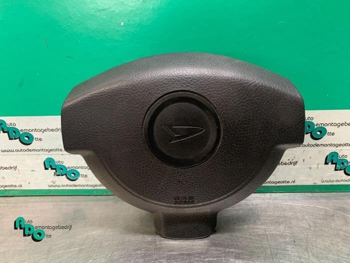 Airbag gauche (volant) d'un Daihatsu Cuore (Cuore 03-), Daihatsu, -, 3 mois de garantie, Utilisé