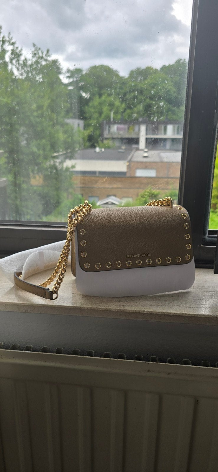nouveau sac Michael Kors, Enlèvement