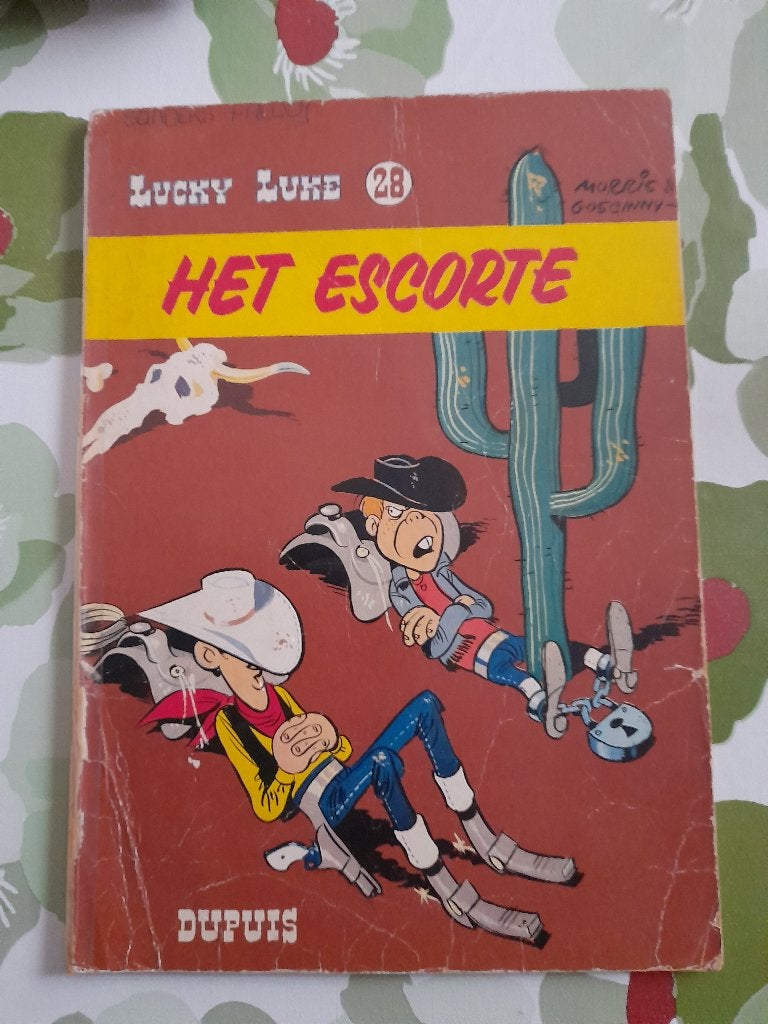 Lucky Luke nr 28 "Het escorte "eerste druk 1966, Ophalen of Verzenden, Gelezen