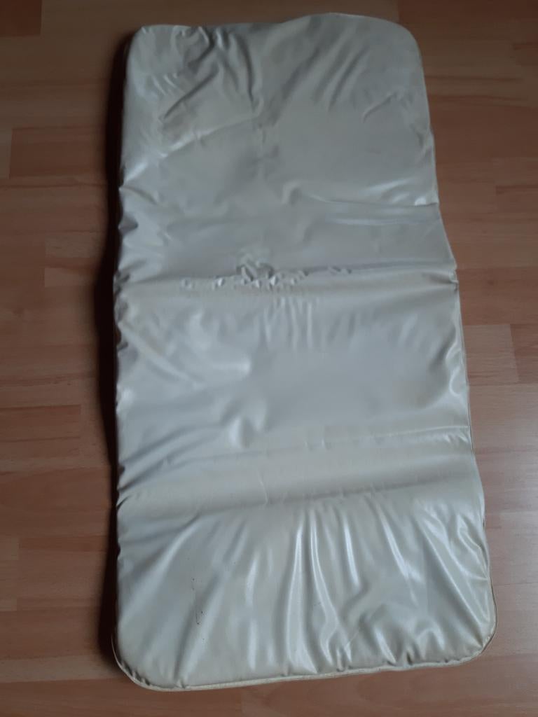 Schuine aankleedkussen, Ophalen