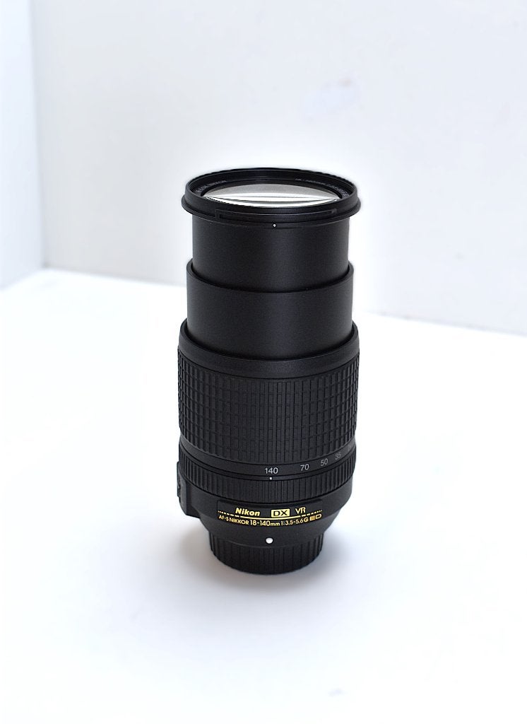 Objectif Nikon TOP 18-140 mm 3,5-5,6G ED DX VR AF-S, TV, Hi-fi & Vidéo, Enlèvement ou Envoi, Utilisé, Nikon, Bouchons d'objectif