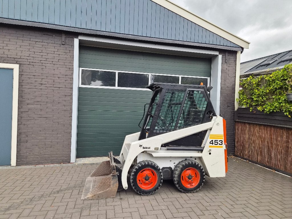 Bobcat Schranklader 453 skitskeer met bak en vorken, Enlèvement, Chargeuse sur pneus ou Chouleur