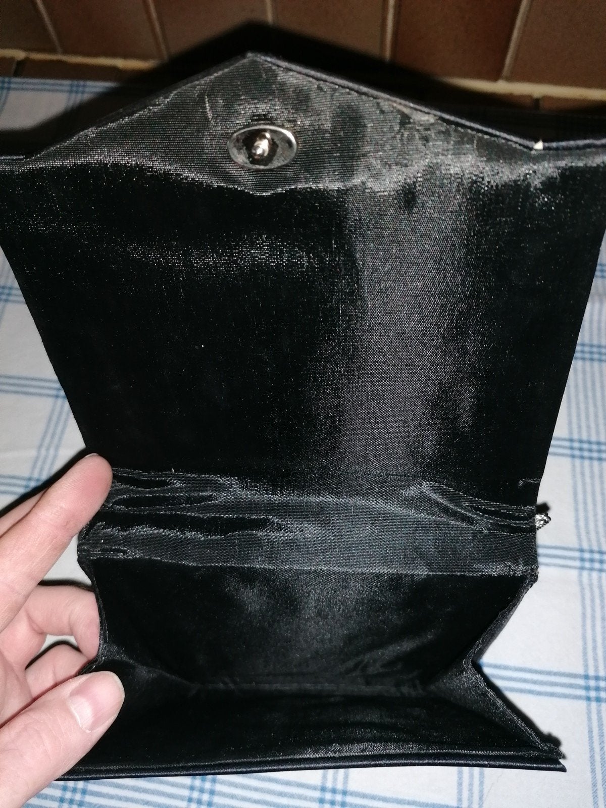 Kleine dames handtas, Ophalen