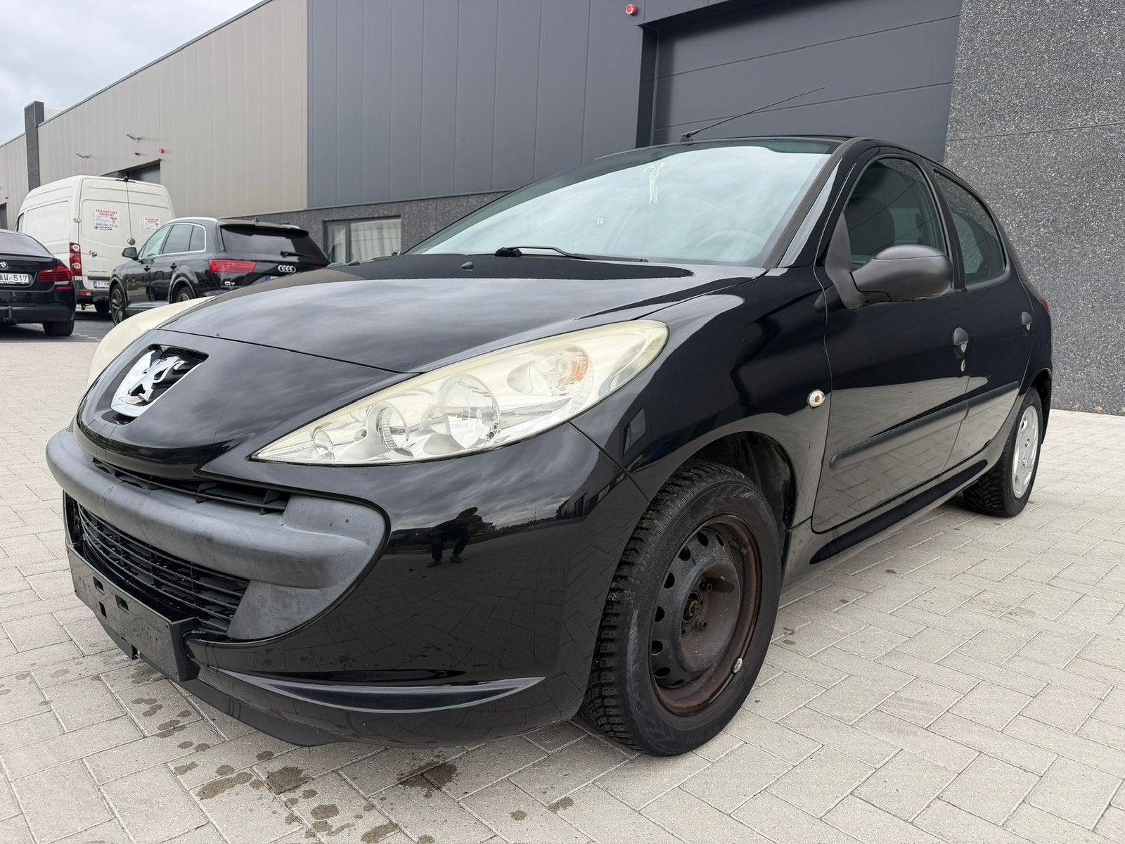 Peugeot 206+ 1.2 benzine met 117.000 km, Auto's, Peugeot, Voorwielaandrijving, Euro 5, Stof, Zwart