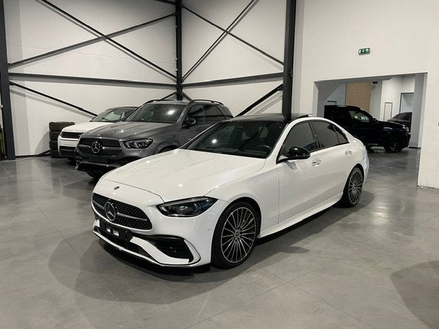 Mercedes C200 4Matic AMG-Line Full Option met Garantie, Auto's, Automaat, Dealer onderhouden, Wit, Bedrijf