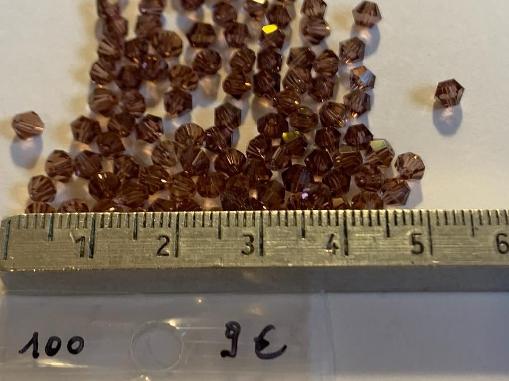 100 Swarovski tolletjes transparant paarsbruin, Ophalen of Verzenden, Nieuw, Kraal