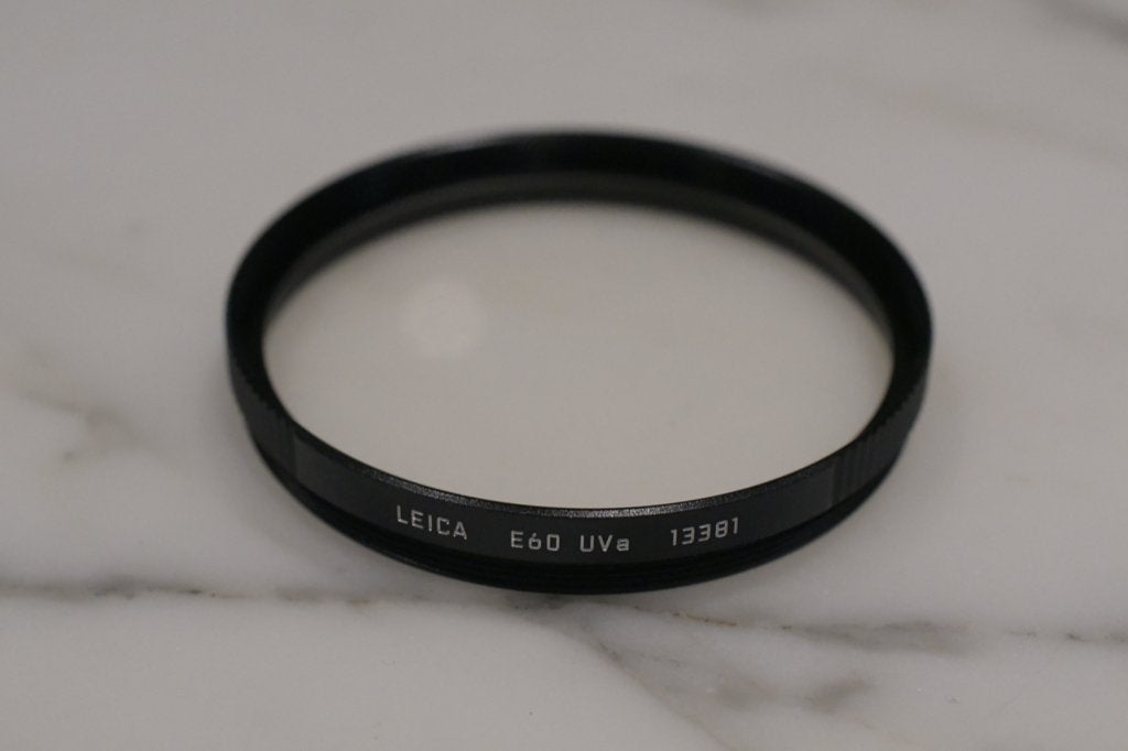 Filtre Leica UVa E60 13381, TV, Hi-fi & Vidéo, Photo | Filtres, Autres marques, Enlèvement ou Envoi, Comme neuf, Filtre UV