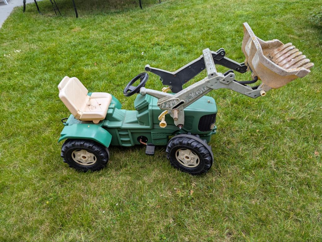 Grote tractor met schep, Ophalen