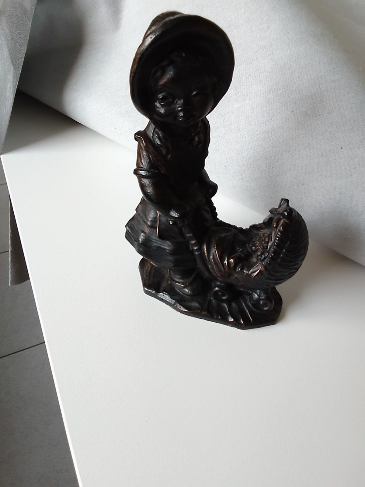 bronzen beeld vrouw met kinderwagen Herselt richting Westerl, Ophalen