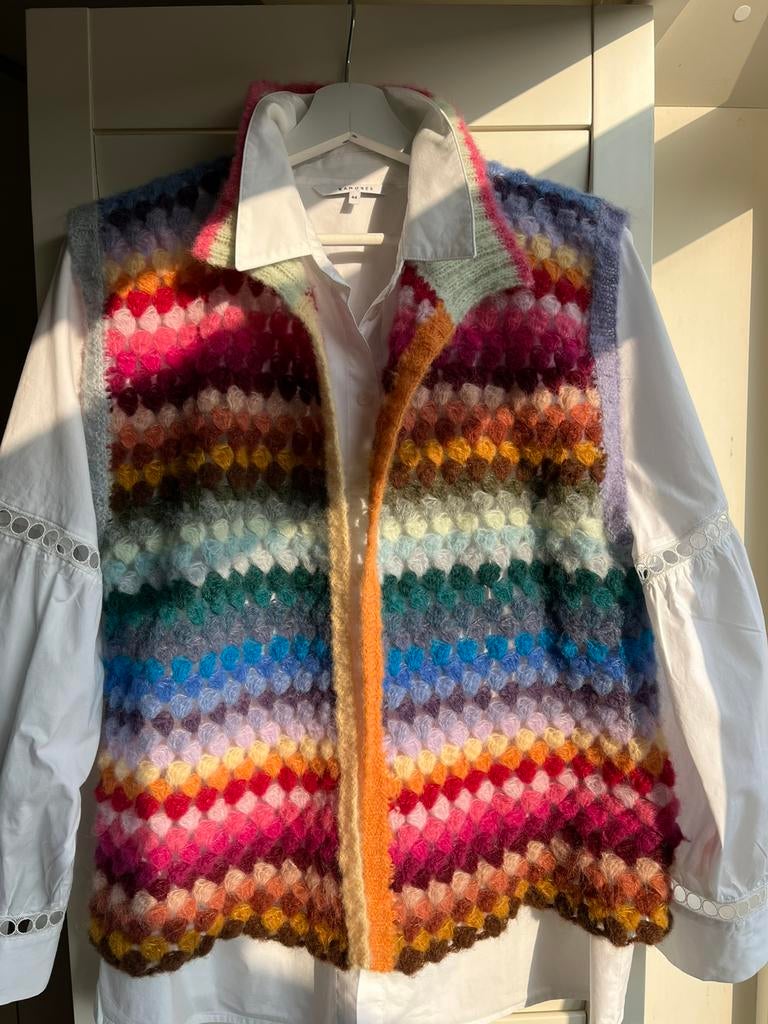 Alpaca en zijde gilet, Ophalen