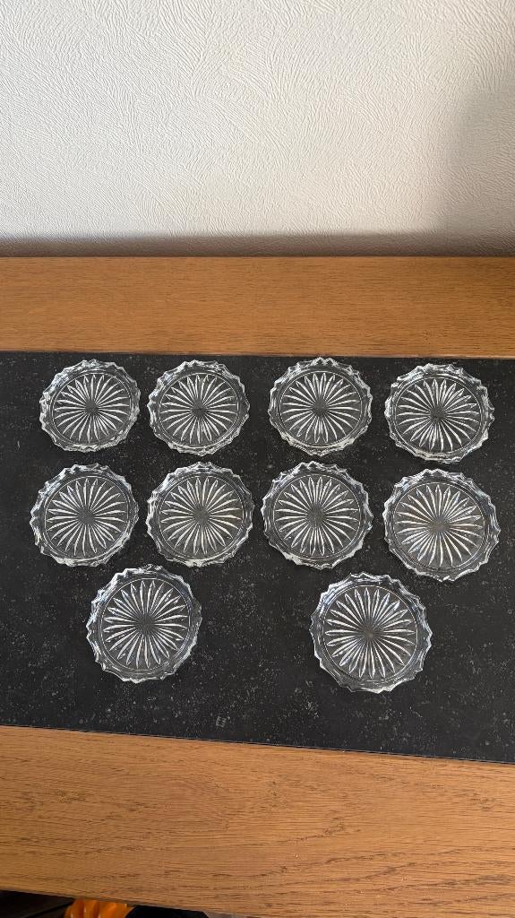 10 glasonderleggers in glas, Ophalen