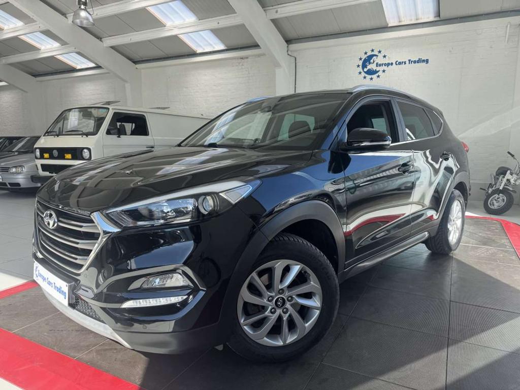 Hyundai Tucson 1.6GDI 132Ch CLIM AUTO CAMERA GPS GAR 12M, Stof, Gebruikt, 1591 cc, Zwart