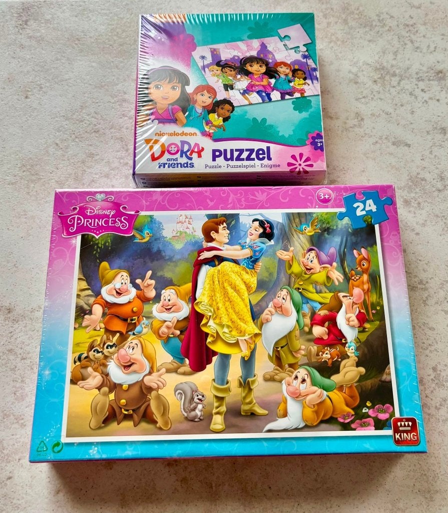 2 nieuwe kinderpuzzels -Disney Princess en Dora(nog geseald), Kinderen en Baby's, Ophalen of Verzenden, 10 tot 50 stukjes, Nieuw