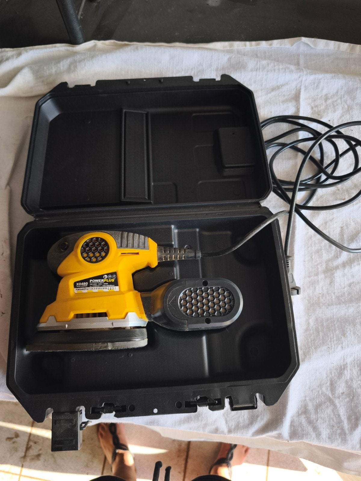 Powerplus schuurmachine, Ophalen