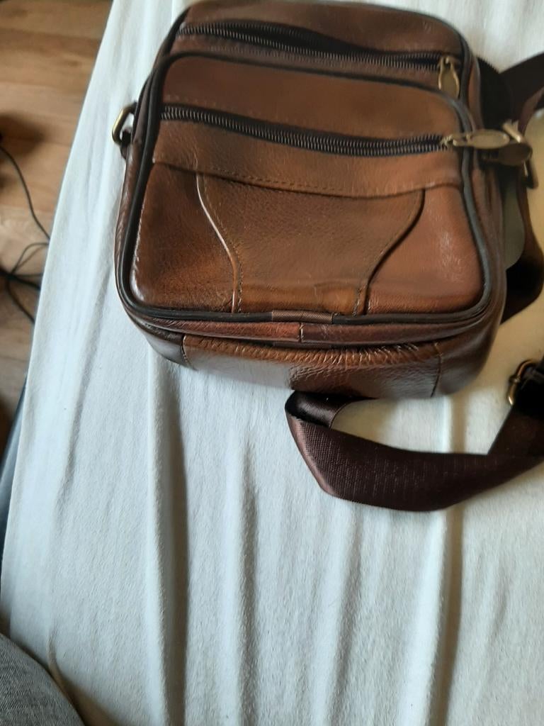 Bruine heren tas, Ophalen