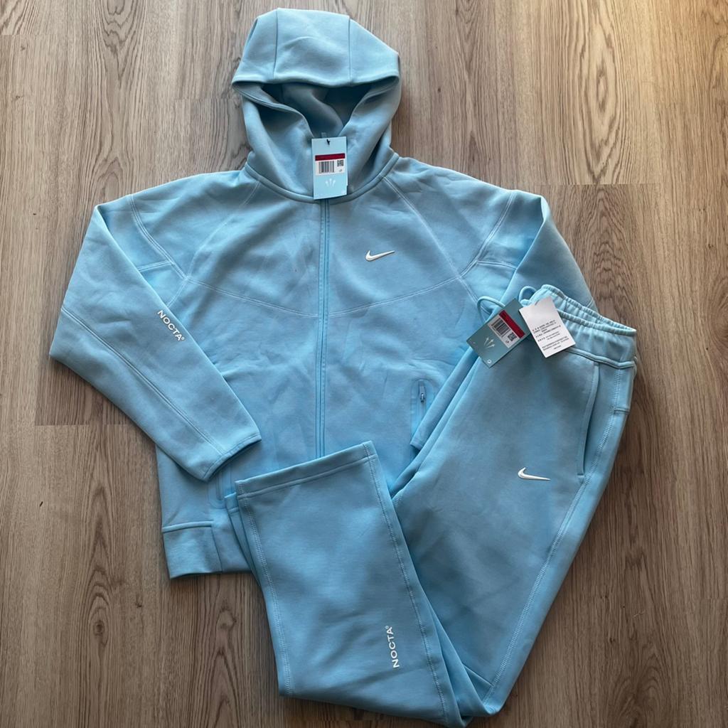 Nike x Nocta trainingspak- Nieuw met prijskaartjes, Kleding | Heren, Maat 52/54 (L), Blauw, Nieuw, Ophalen of Verzenden